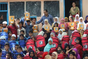 donating books and school supplies to children in need